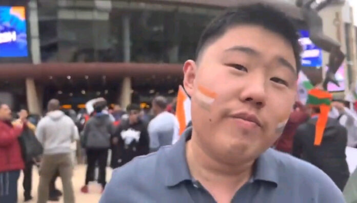 A Chinese man was seen cheering for Virat Kohli and Team India in Hindi, outside the Adelaide Oval.